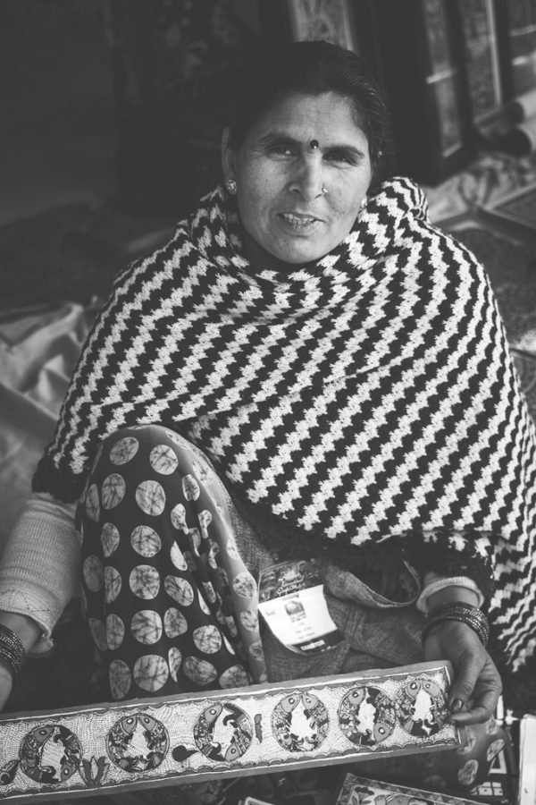 Local woman proudly shows her artwork in one of the 1000 plus stalls at Surajkund Craft Mela.